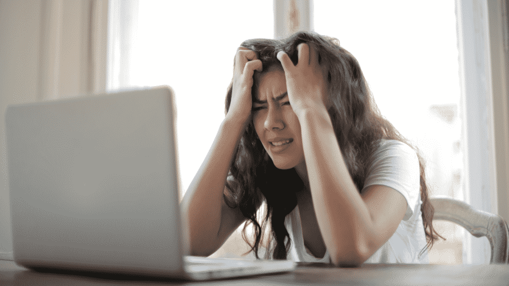 frustrated woman on laptop